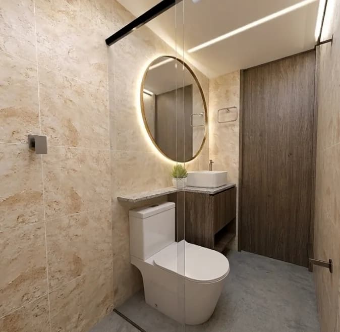Baño con espejo circular retroiluminado